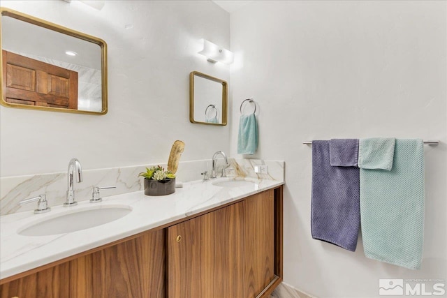 bathroom with dual bowl vanity