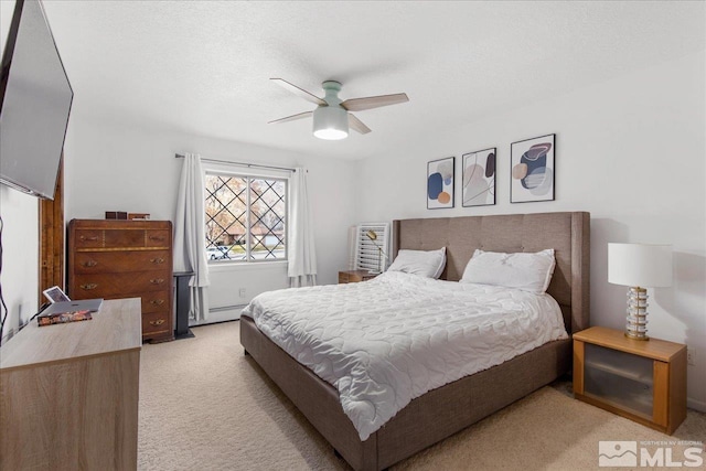 bedroom featuring light colored carpet, ceiling fan, and a baseboard heating unit