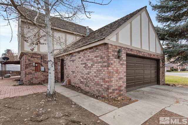 view of side of property featuring a garage