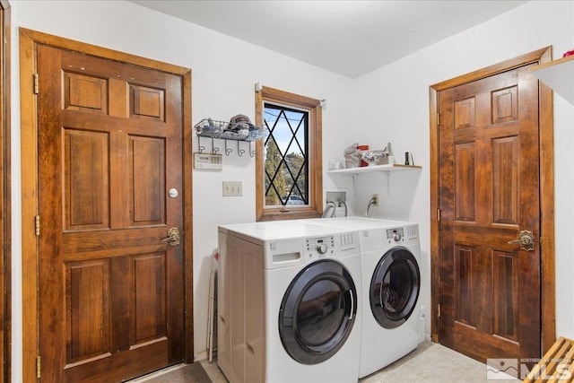 laundry area featuring washer hookup and washing machine and dryer