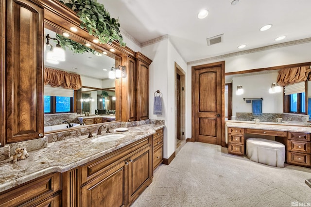 bathroom with vanity with extensive cabinet space