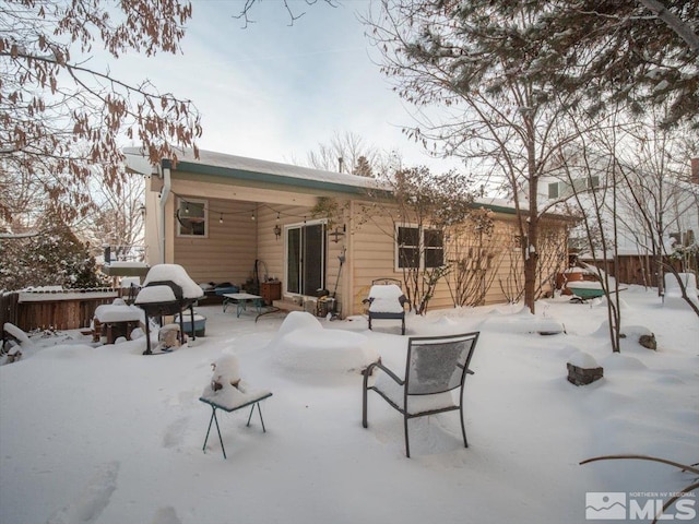 view of snow covered house