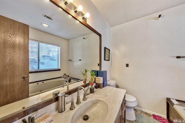 bathroom featuring a washtub, oversized vanity, and toilet