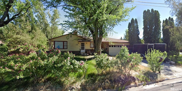 single story home with a garage