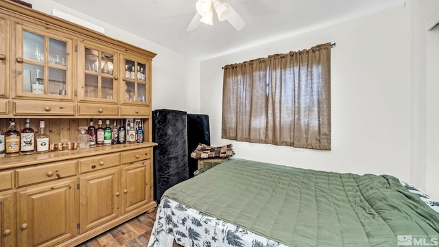 bedroom featuring ceiling fan and dark hardwood / wood-style floors