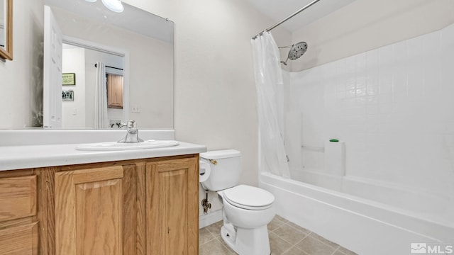 full bathroom featuring shower / bath combo with shower curtain, toilet, vanity with extensive cabinet space, and tile floors