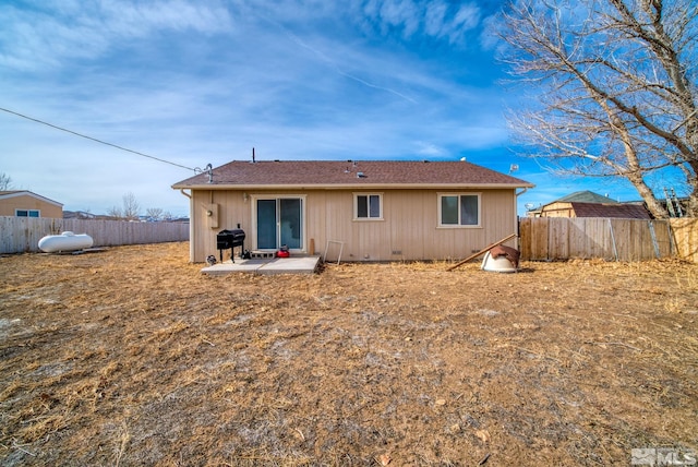 rear view of property featuring a patio