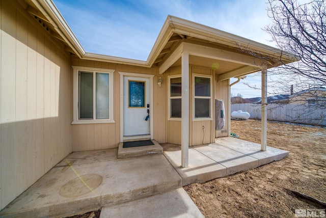 entrance to property with a patio