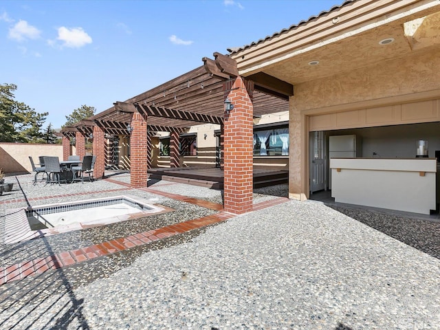 view of patio featuring a pergola and a hot tub