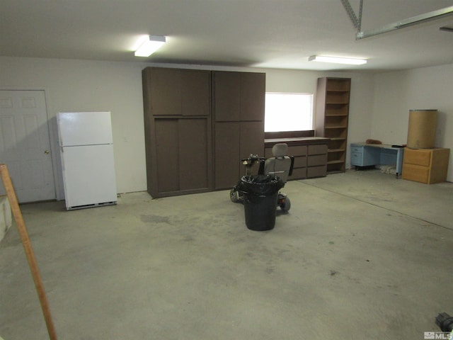 garage featuring white fridge