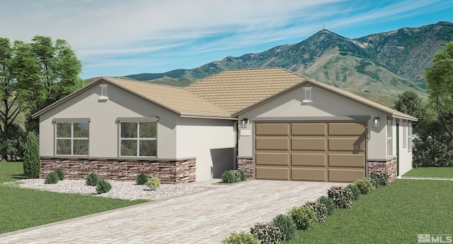 view of front of house with a garage, a mountain view, and a front yard