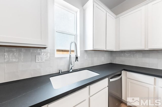 kitchen featuring backsplash, plenty of natural light, and stainless steel dishwasher