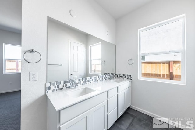 bathroom featuring backsplash, tile patterned flooring, and vanity