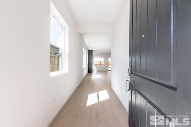 hall with light hardwood / wood-style flooring