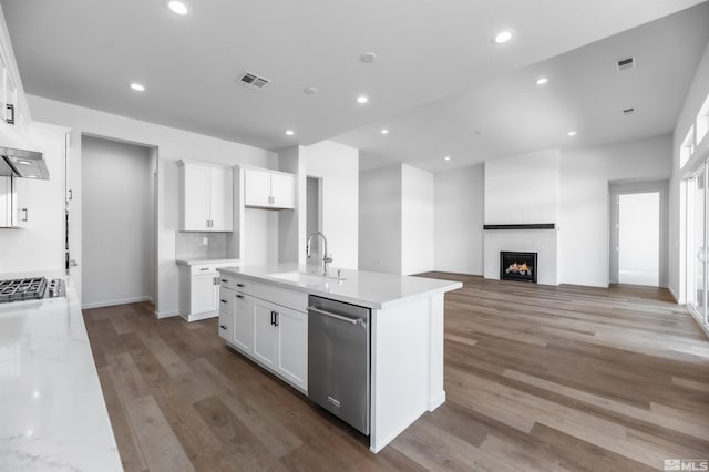 kitchen featuring white cabinets, appliances with stainless steel finishes, sink, and light wood-type flooring