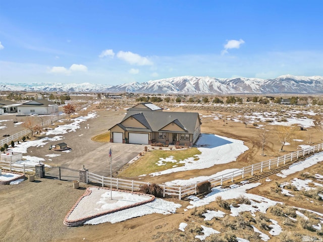 snowy aerial view with a mountain view