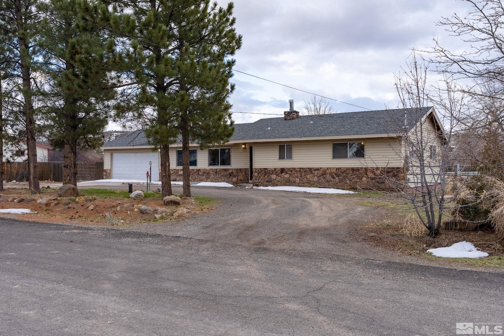 ranch-style home with a garage