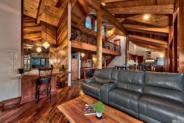 living room featuring high vaulted ceiling, beam ceiling, wood ceiling, and dark wood-type flooring