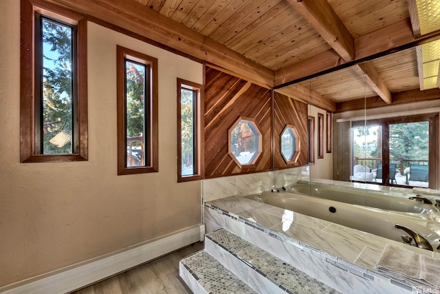 interior space with wood ceiling, beam ceiling, multiple windows, and light wood-type flooring