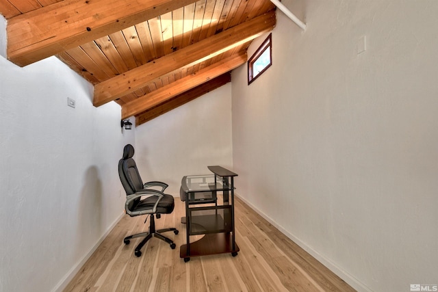 office featuring light hardwood / wood-style flooring, vaulted ceiling with beams, and wood ceiling