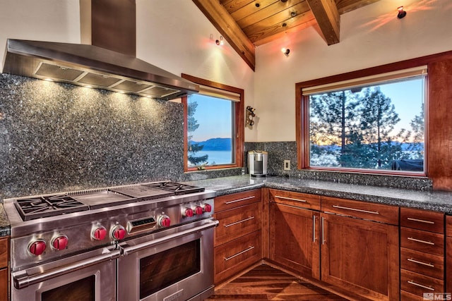 kitchen with double oven range, wooden ceiling, dark wood-type flooring, wall chimney range hood, and tasteful backsplash