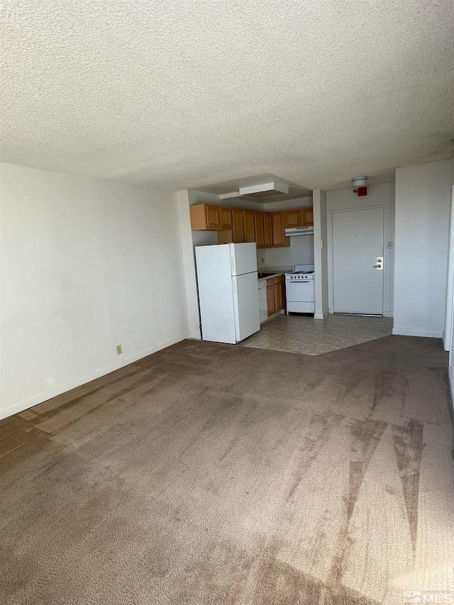 unfurnished living room featuring a textured ceiling and dark carpet