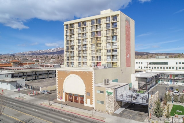 view of building exterior featuring a mountain view