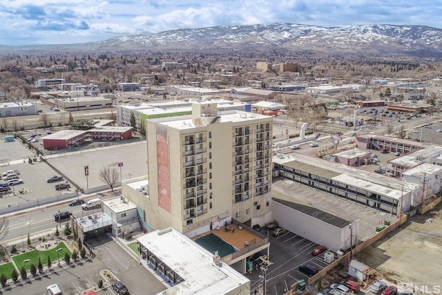 birds eye view of property featuring a mountain view