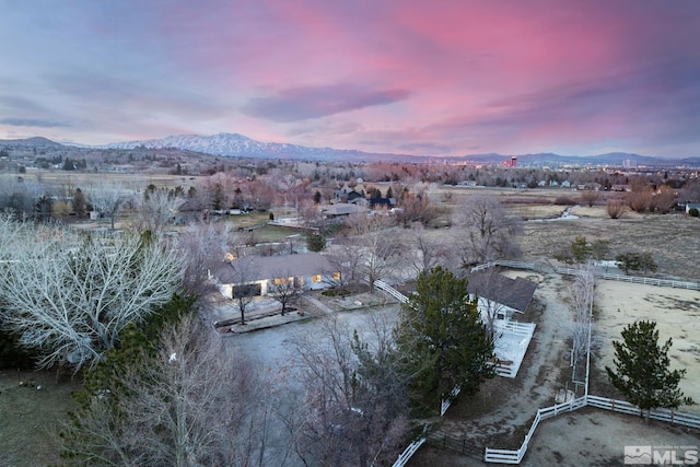 aerial view at dusk with a mountain view