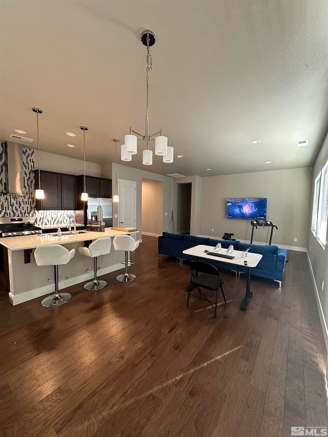 rec room featuring dark hardwood / wood-style flooring and sink