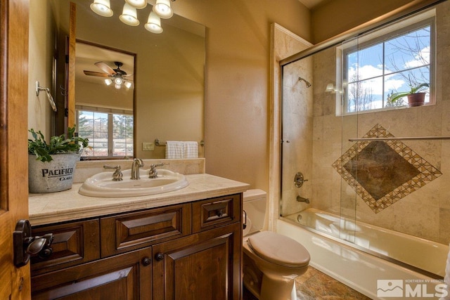 full bathroom with tile flooring, ceiling fan, bath / shower combo with glass door, toilet, and oversized vanity