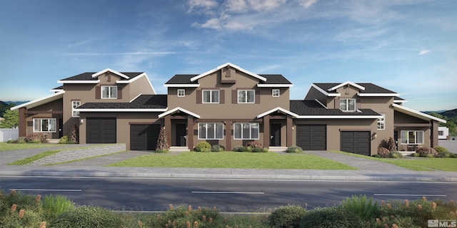 craftsman-style home featuring a front yard and a garage