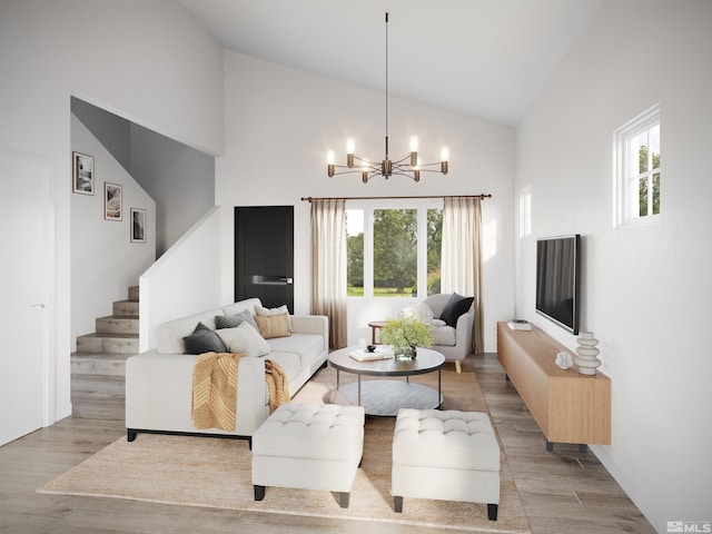 living room featuring high vaulted ceiling, an inviting chandelier, and light hardwood / wood-style flooring