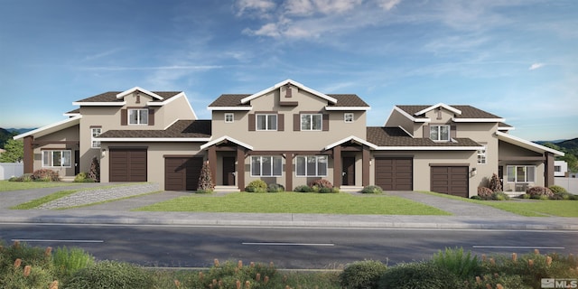 craftsman-style home featuring a front lawn and a garage