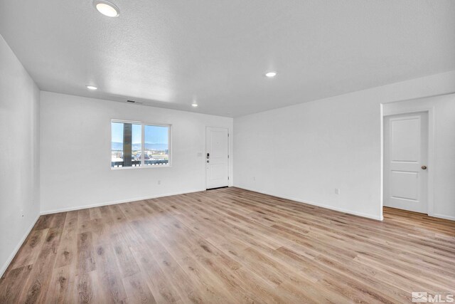 unfurnished room featuring light hardwood / wood-style flooring