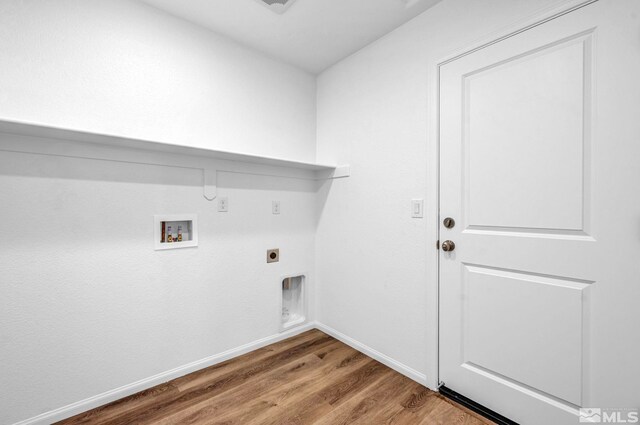 washroom featuring electric dryer hookup, hardwood / wood-style flooring, and washer hookup