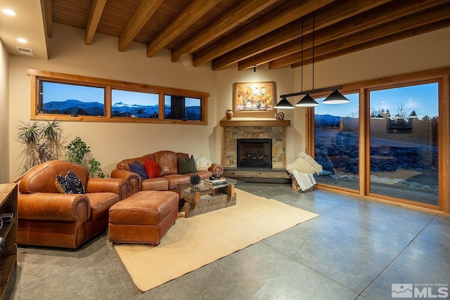 living room featuring a fireplace, wooden ceiling, a mountain view, and beamed ceiling