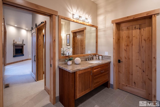 bathroom featuring tile floors and large vanity