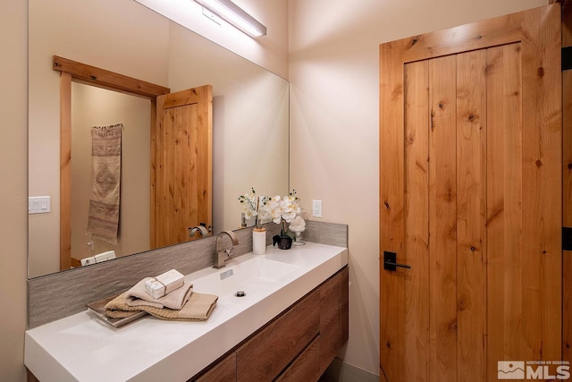 bathroom featuring oversized vanity