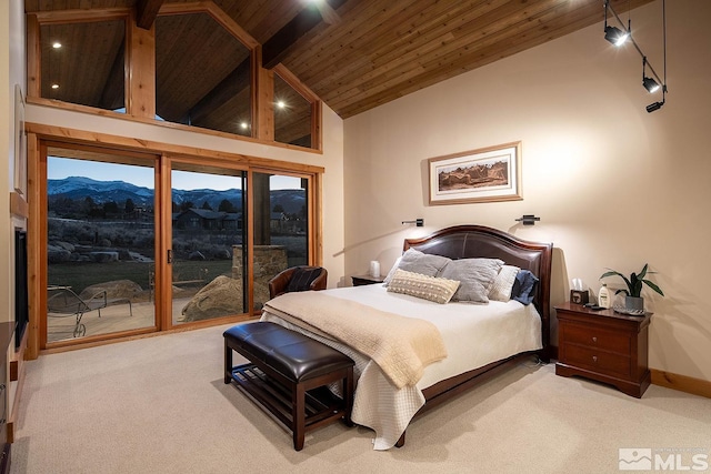 carpeted bedroom with access to outside, wooden ceiling, high vaulted ceiling, and a mountain view