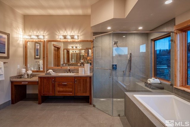 bathroom with independent shower and bath, tile flooring, and vanity