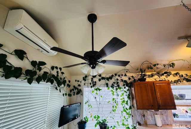 room details with an AC wall unit and ceiling fan