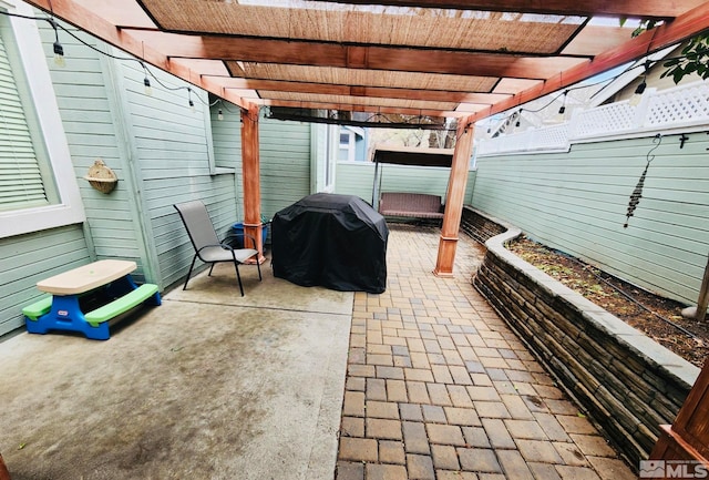 view of patio / terrace featuring a grill and a pergola