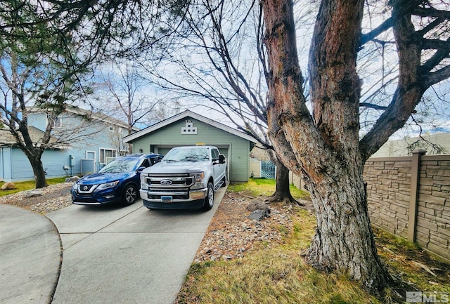 view of front facade with an outdoor structure and a garage