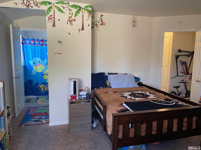 bedroom with crown molding and carpet floors