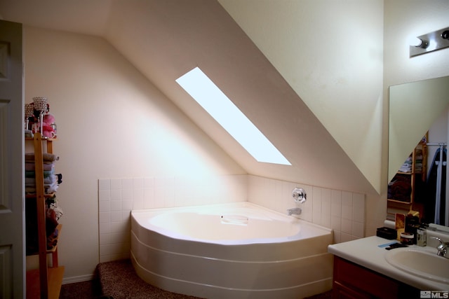 bathroom with tile walls, lofted ceiling, and a tub to relax in