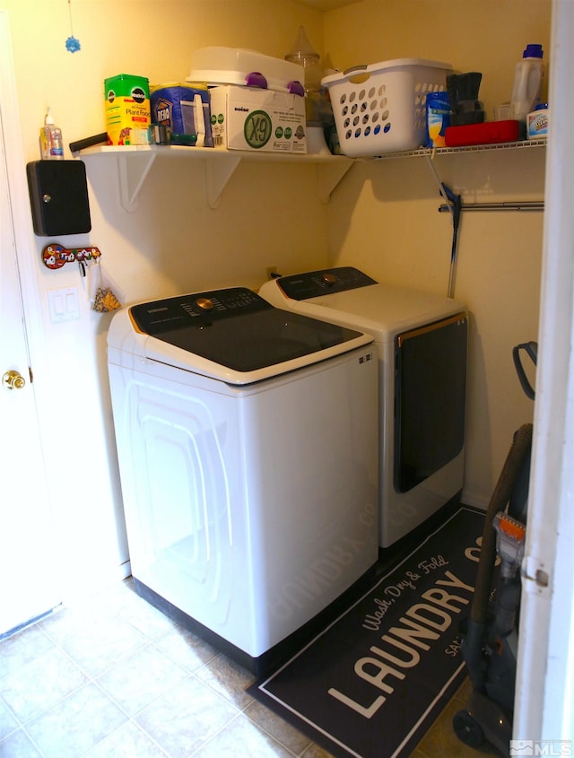 laundry room featuring washer and clothes dryer