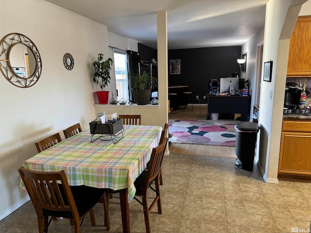 dining space with light wood-type flooring