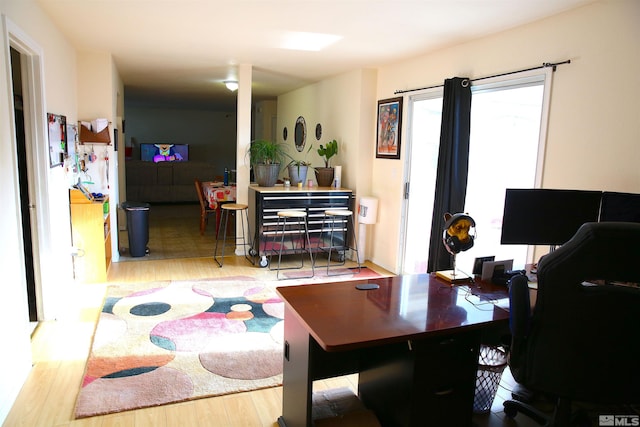 office with light hardwood / wood-style flooring