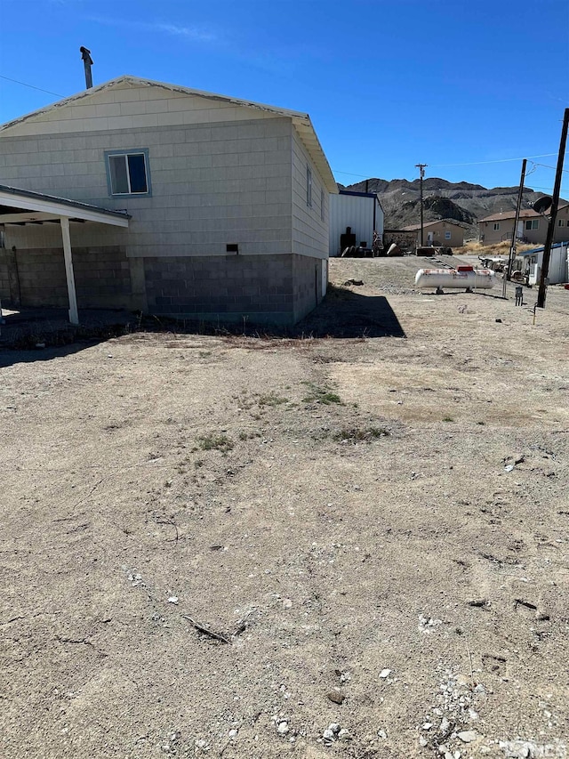 view of side of property with a mountain view